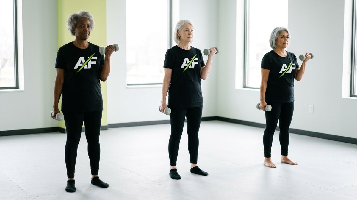 Three women over 60 doing controlled bicep curls with light dumbbells